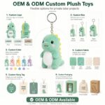 Green dinosaur plush keychain embroidered detail